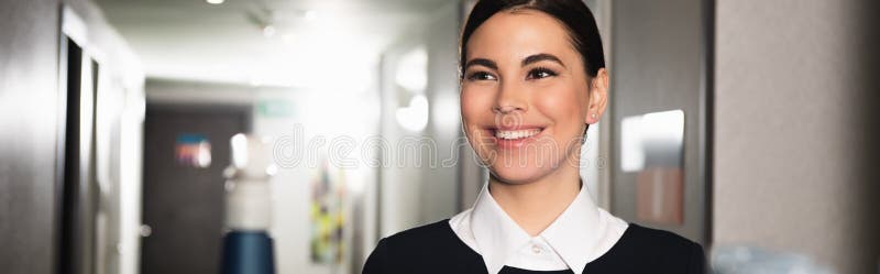 happy maid smiling and looking away royalty free stock photo