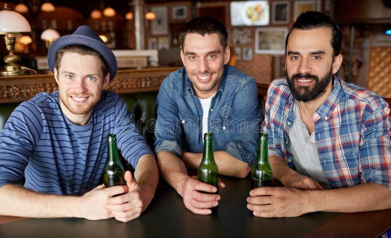 Happy Male Friends Drinking Beer at Bar or Pub Stock Photo - Image of ...