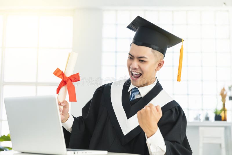 Happy Male Graduation Watching the Laptop and Holding Diploma and ...