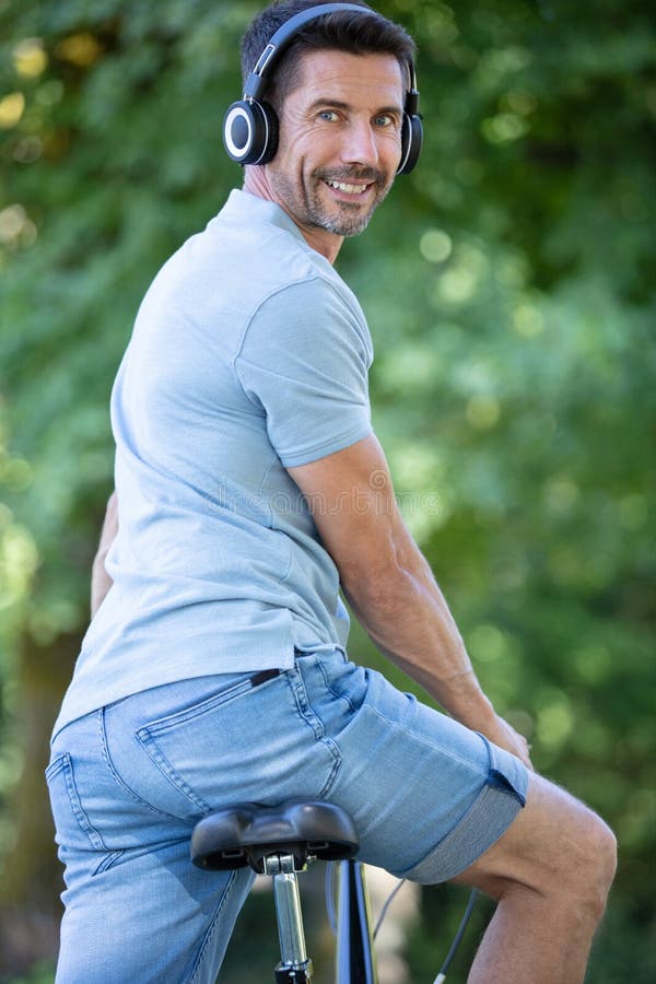 Happy man on bike stock image. Image of sport, sunset 258972685