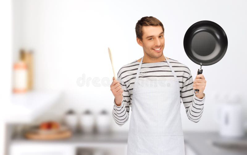 Happy man or cook in apron with pan and spoon