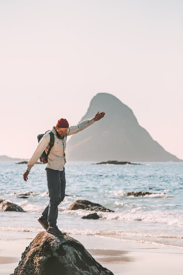 Happy man enjoying ocean beach traveling active lifestyle