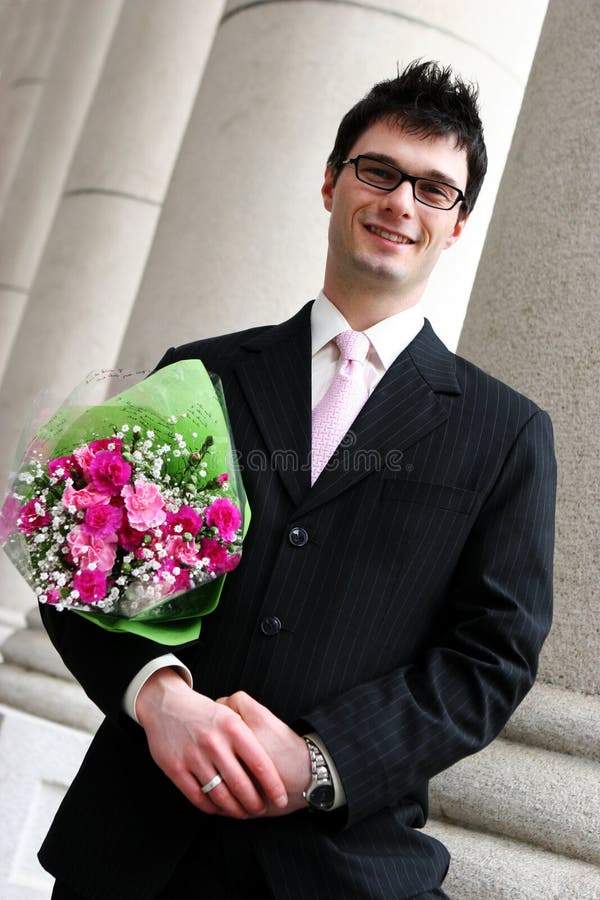 Happy man with flowers