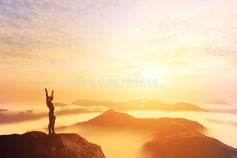 Happy man with hands up on the top of the world above clouds. Bright future