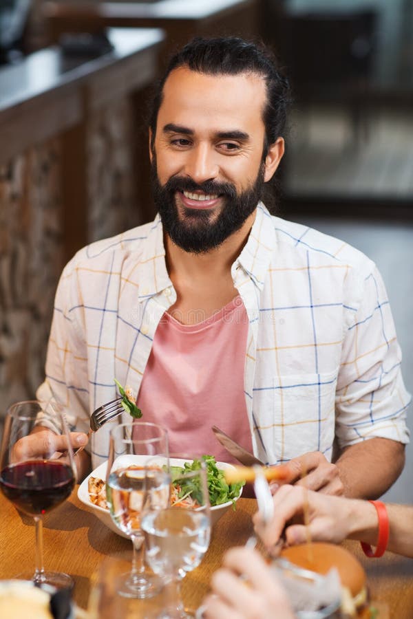 Happy Man Having Dinner At Restaurant Stock Photo - Image of dining