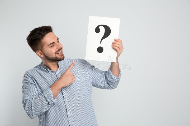 Happy Man Holding Question Mark Sign on Background Stock Photo - Image of  paper, query: 253963588