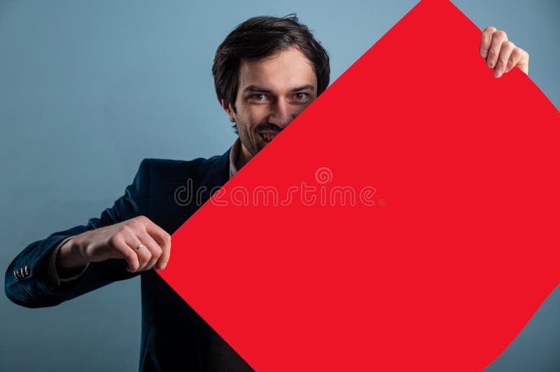 Happy smiling man showing blank signboard with empty copyspace area for slogan or advertising text message stock image