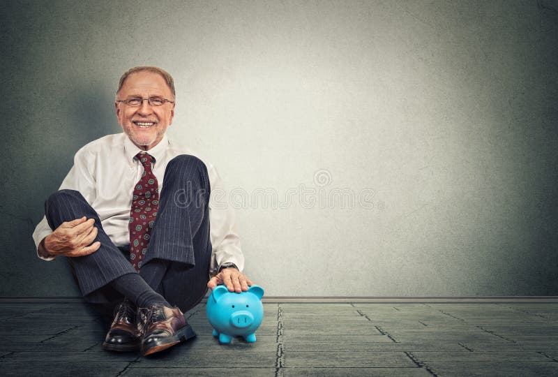Happy man with piggy bank royalty free stock image