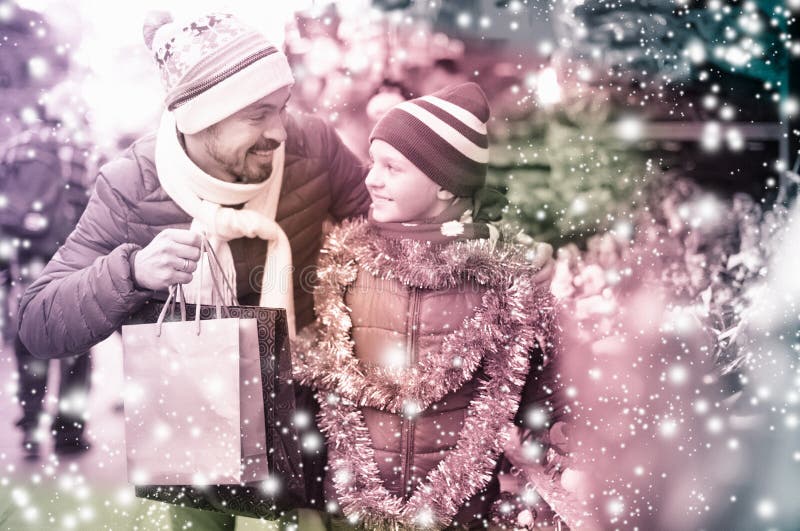 Happy man with small daughter near Christmas decoration royalty free stock image Happy man with small daughter near Christmas decoration royalty free stock image