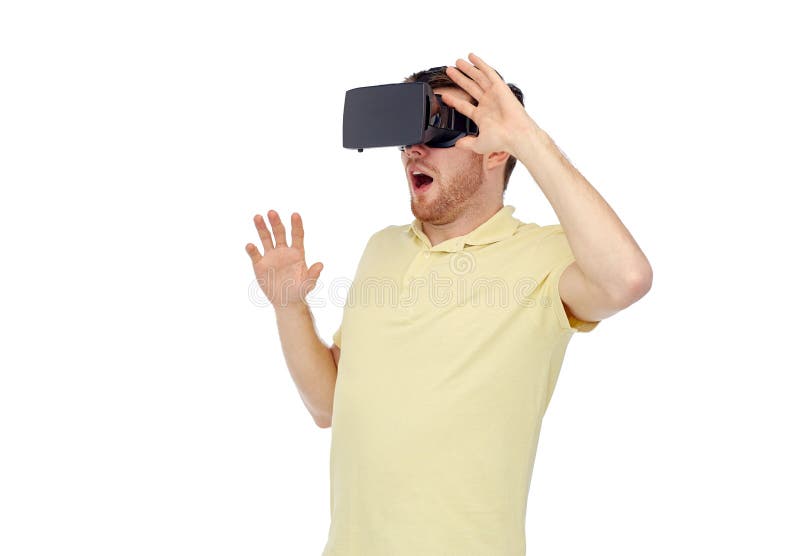3d technology, virtual reality, entertainment and people concept - happy young man with virtual reality headset or 3d glasses playing game. 3d technology, virtual reality, entertainment and people concept - happy young man with virtual reality headset or 3d glasses playing game