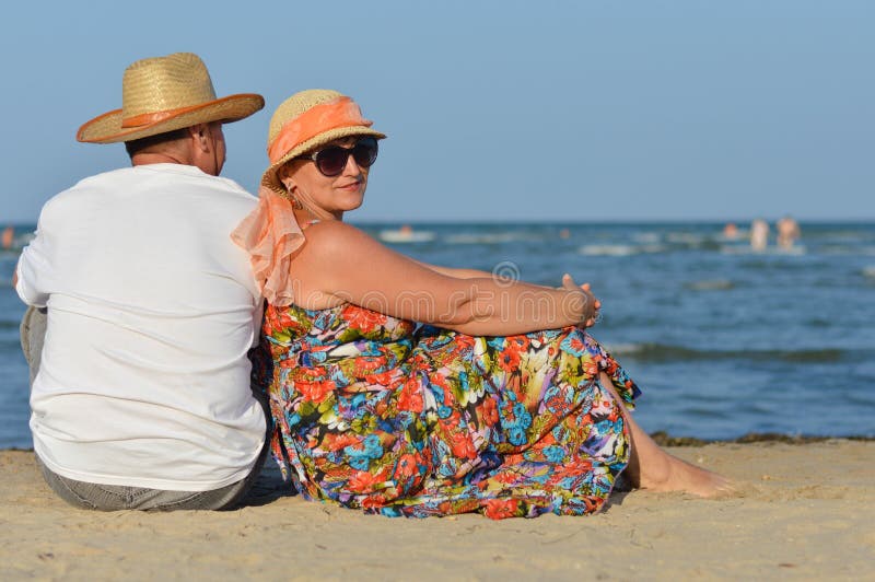 Sea Walk And Happy Mature Couple At Seashore Sandy Beach And Holding Hands Stock Image Image Of