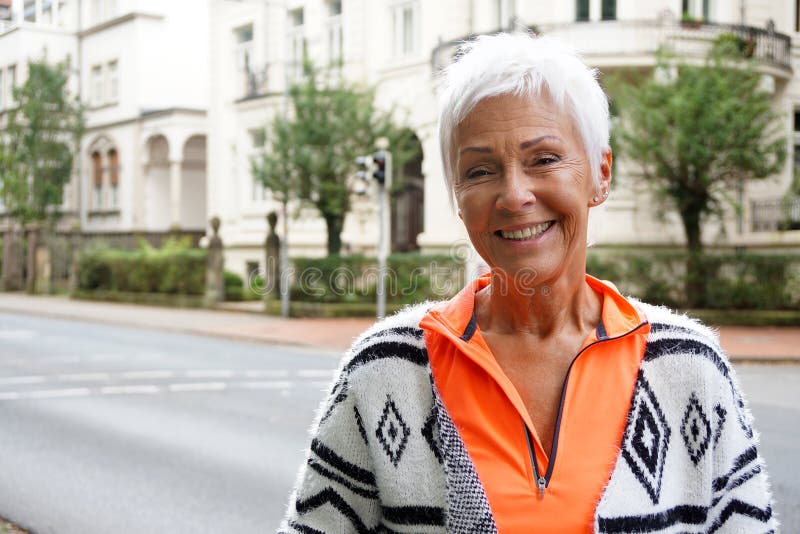 Happy mature woman on street royalty free stock photos Happy mature woman on street royalty free stock photos