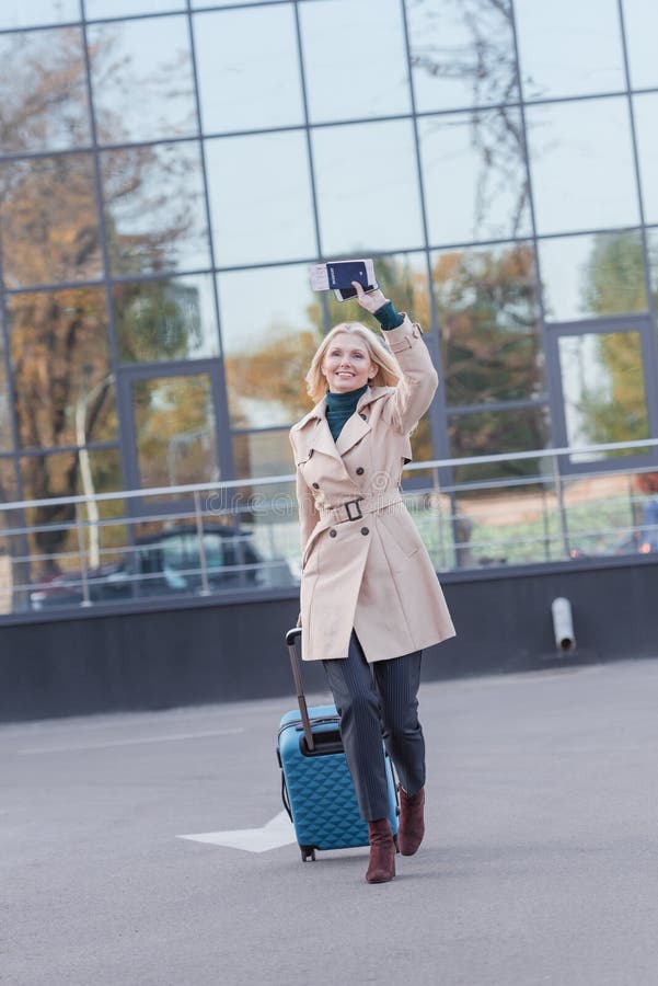 Woman with Flight Ticket Waving Hand Stock Image - Image of suitcase ...