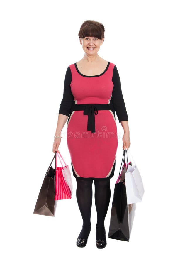 Happy Mature Woman Walking with Her Shopping Purchases Stock Image ...