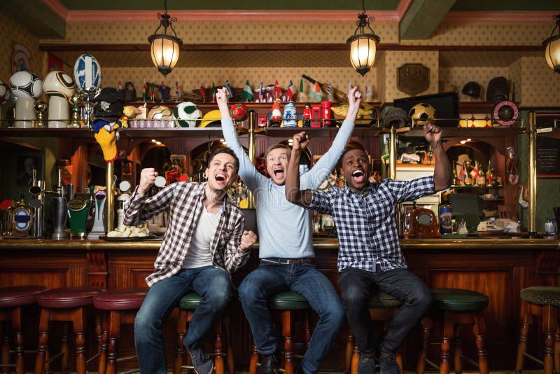 Fans at the pub stock image. Image of casual, cheering - 16155707