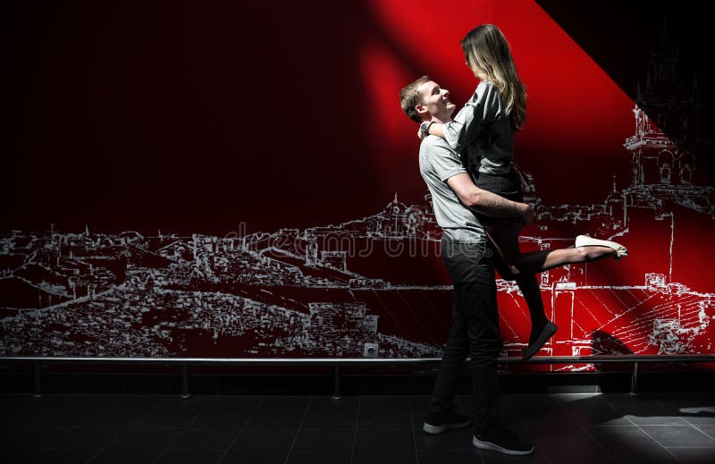 young cheery family on red dark background stock photos young cheery family on red dark background stock photos
