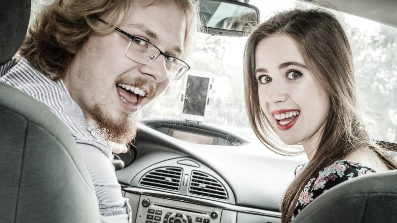 Happy man and woman in car royalty free stock images