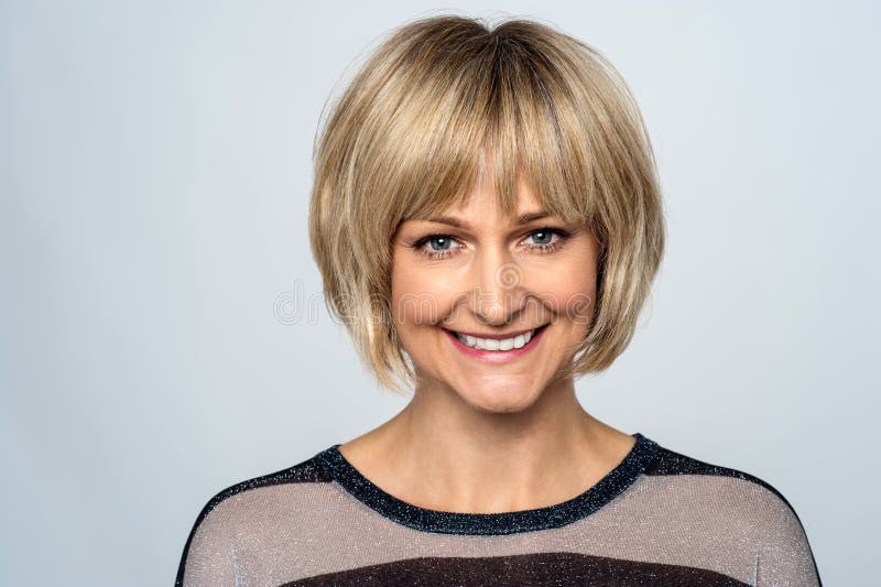Happy middle aged woman posing for a portrait royalty free stock photos Happy middle aged woman posing for a portrait royalty free stock photos