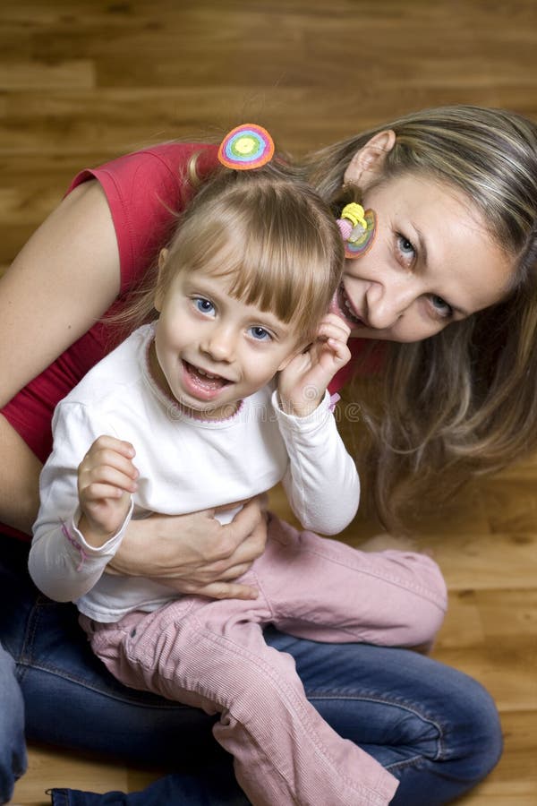 Happy mom plays with her daughter