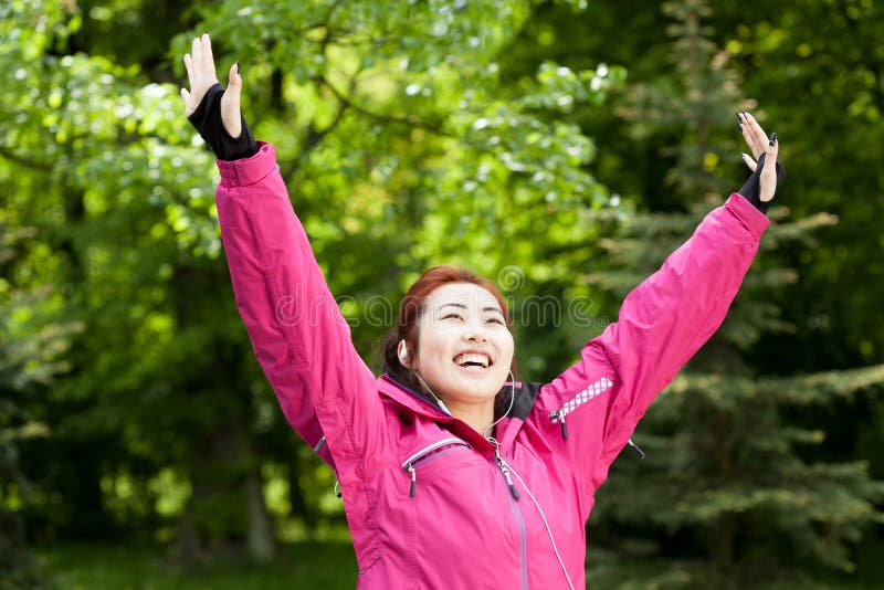 Happy mongolian woman likes sport stock images