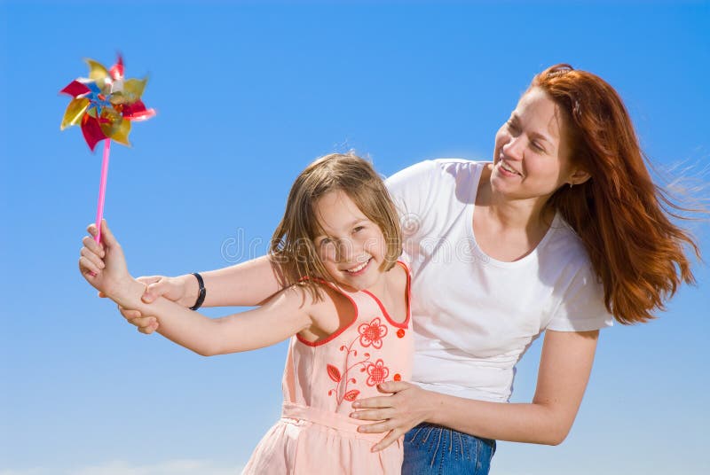 Happy mother and daughter having fun