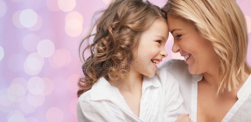 Happy mother and daughter hugging