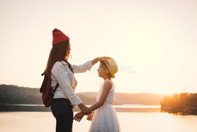 Happy mother and daughter in nature during sunset stock photo Happy mother and daughter in nature during sunset stock photo