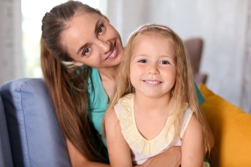 Happy Mother With Daughter Sitting On Sofa At Home Stock Image Image Of Little Cute 151141901 