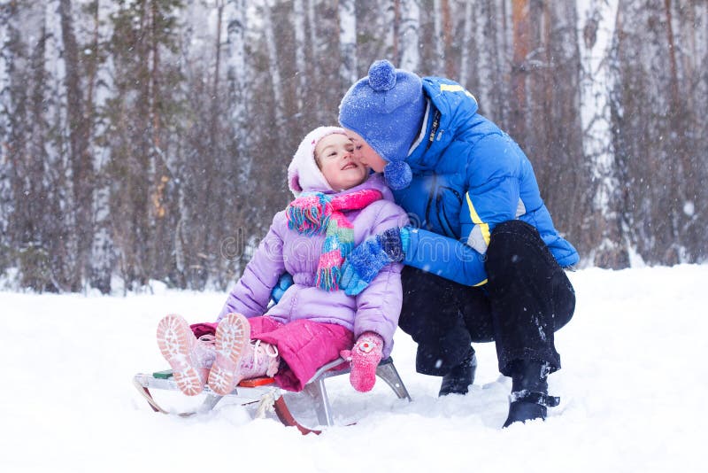 Happy mother and daughter in a winter park