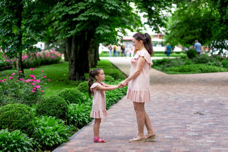 Happy Mother And Daughter 5 6 Years Old Walk In The Park In The Summer 