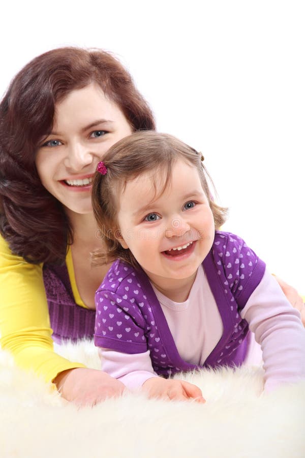 Happy mother embraces her laughing daughter