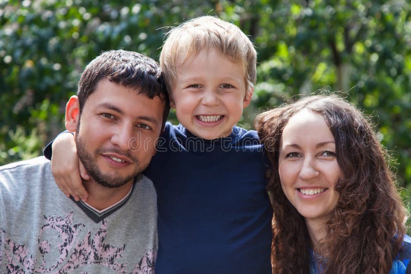 Happy mother, father and son