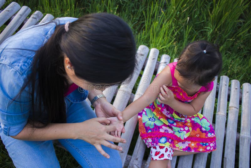 Happy Mother and her child play outdoors having fun, Green rice field back ground royalty free stock photography Happy Mother and her child play outdoors having fun, Green rice field back ground royalty free stock photography