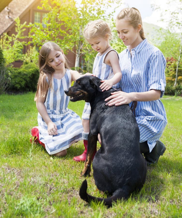 Happy Mother Her Daughters Dog Stock Photos Free & RoyaltyFree Stock