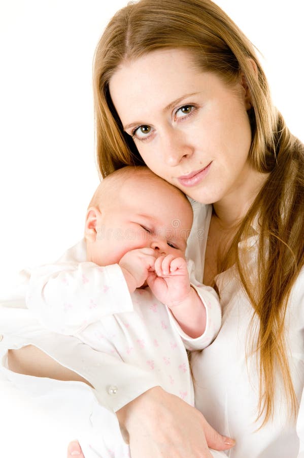 Happy mother holding a young baby girl