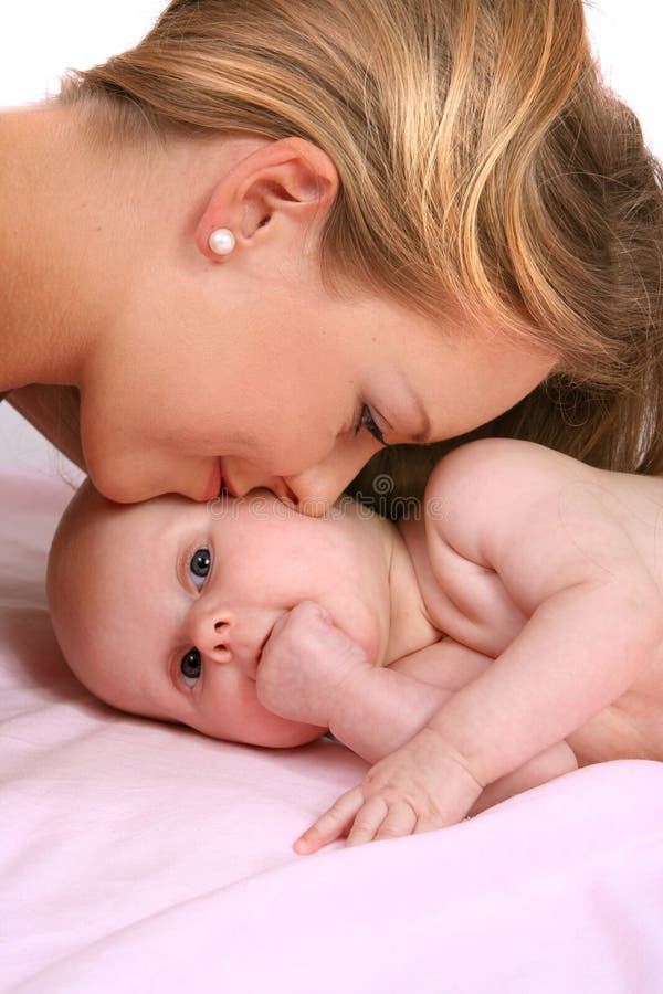 Happy mother kissing her little child