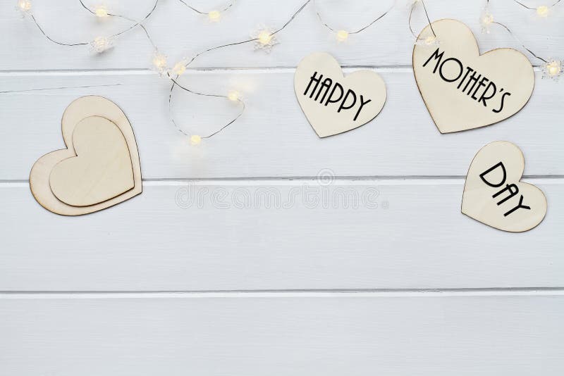 https://thumbs.dreamstime.com/b/happy-mother-s-day-over-hearts-fairy-lights-overhead-view-wooden-message-flat-wood-table-top-background-copy-85758635.jpg