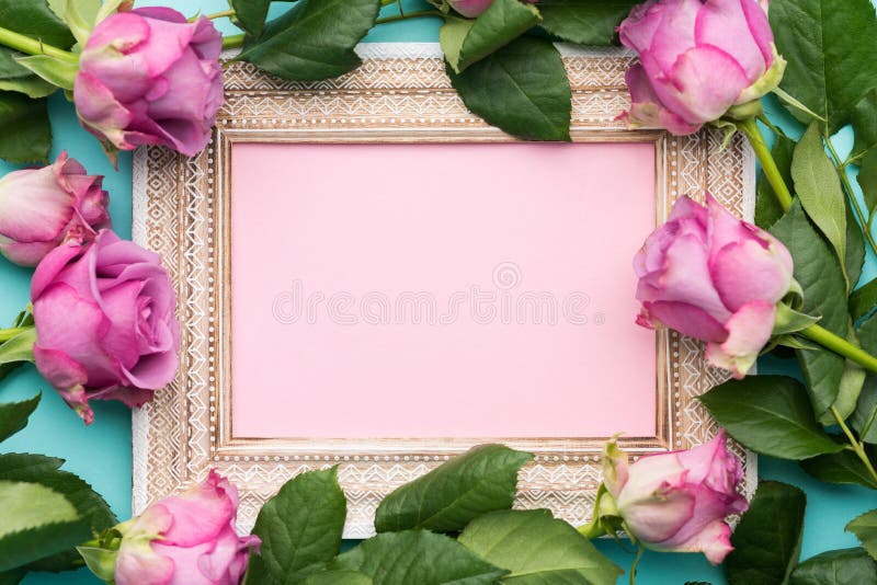 Happy Mother`s Day, Women`s Day, Valentine`s Day or Birthday Flat Lay Background. Beautiful wooden vintage picture frame, fresh pink roses and copy space. Happy Mother`s Day, Women`s Day, Valentine`s Day or Birthday Flat Lay Background. Beautiful wooden vintage picture frame, fresh pink roses and copy space.