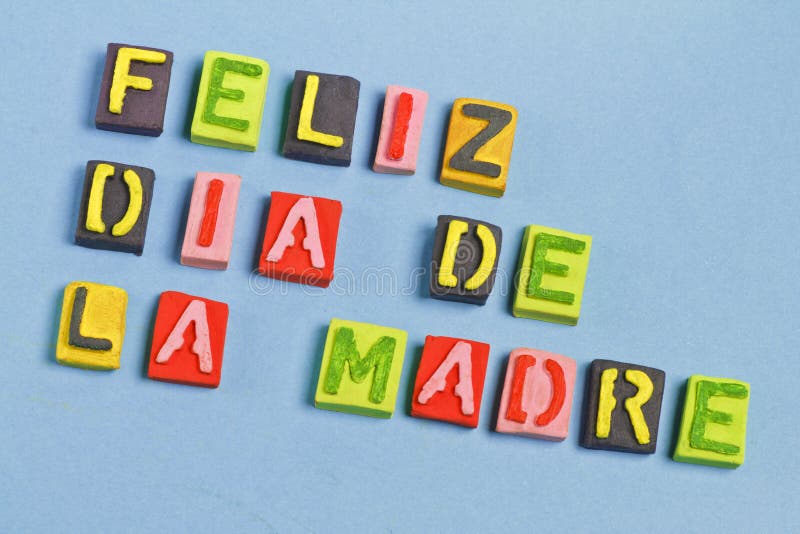 Happy Mother's day words. On blue background, words on spanish stock photography