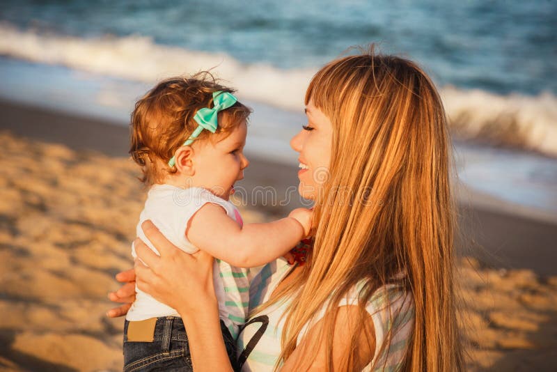 Happy Mother And Small Daughter Sitting And Playing Together At Beach My Xxx Hot Girl 