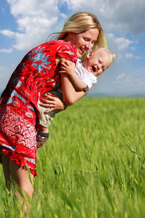 Happy mother and son in field