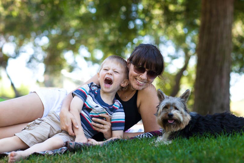 Happy mother and son on a lawn