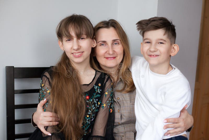 Happy mother and two children at home royalty free stock photography