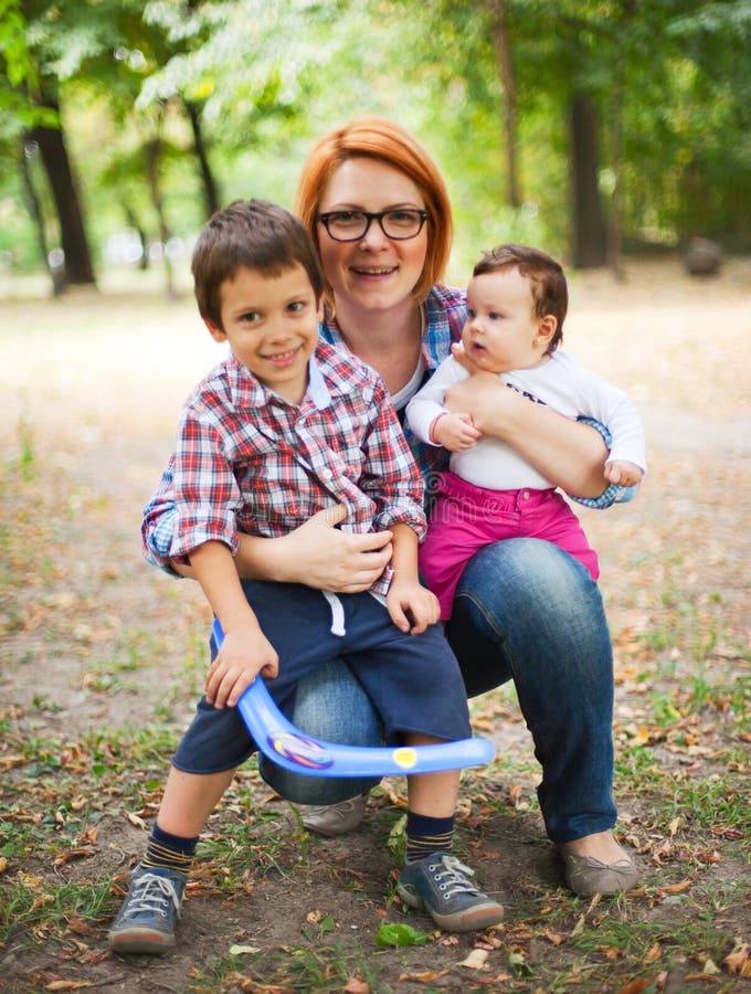 Happy Mother with Two Children Stock Image - Image of moments, smiling