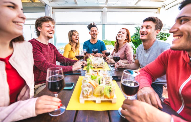 Happy Multicultural People Having Fun Together Drinking Wine At Penthouse On Private Home Party