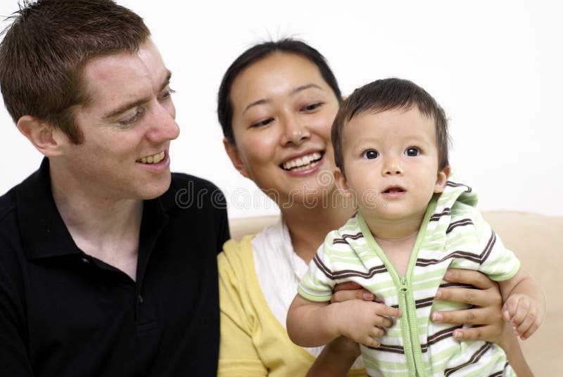 Happy multiracial family with baby