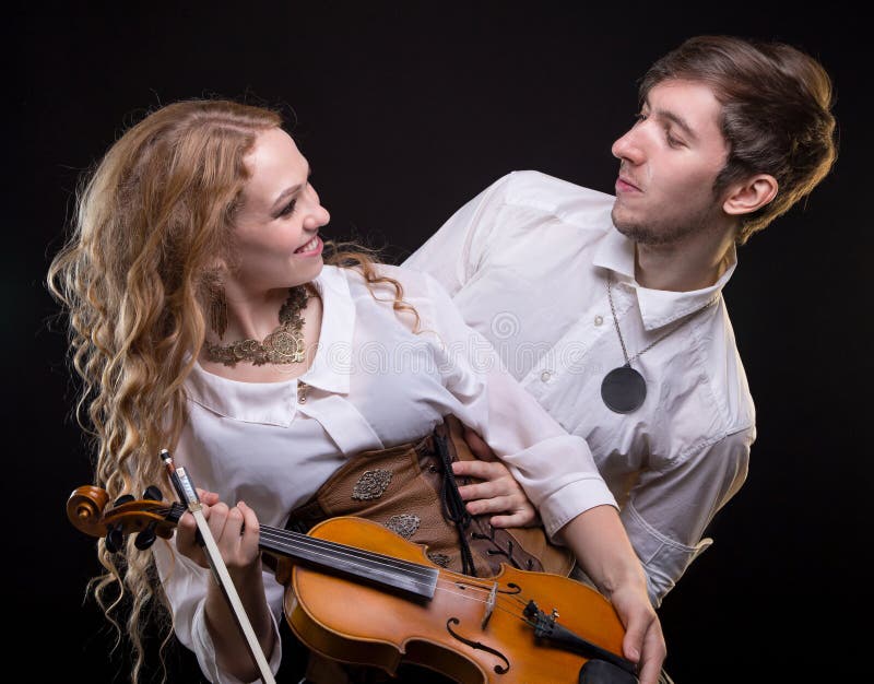  Couple  holding a violin  stock image Image of artistic 