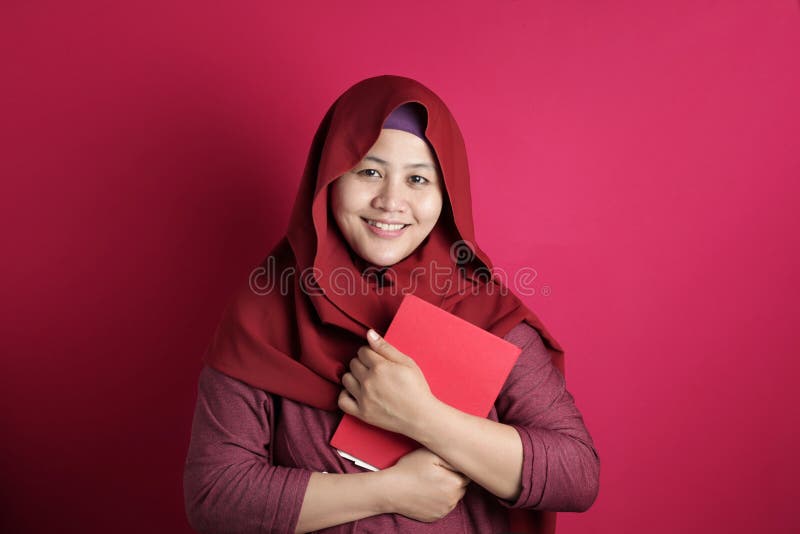 Happy Muslim Lady with Book royalty free stock photo Happy Muslim Lady with Book royalty free stock photo