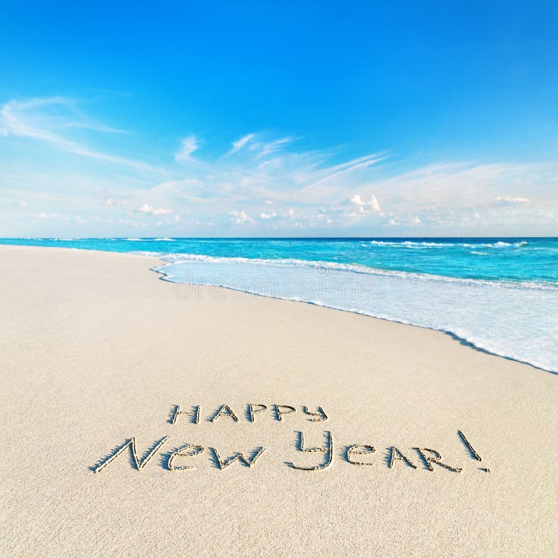 Happy New Year Caption at Tropical Ocean Beach Against Waves Stock