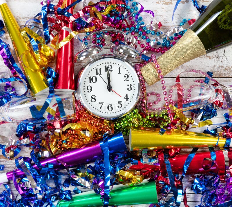 Happy New Year Celebration with clock in center of party objects stock photo Happy New Year Celebration with clock in center of party objects stock photo
